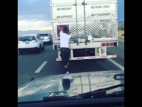 Man removes Confederate battle flag off a truck in the middle of traffic