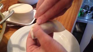 Wrapping up dumplings for pot stickers.