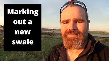 Installing a new adjustable water harvesting permaculture swale on contour  part 1: Marking out.