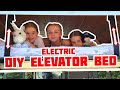 installed our DIY custom elevator bed against the clock in our bus conversion