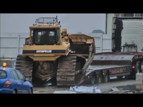 Bulldozer slips off truck