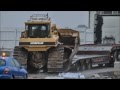 Bulldozer slips off truck