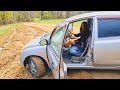 car stuck in mud wheel spinning on grass pedalpumping