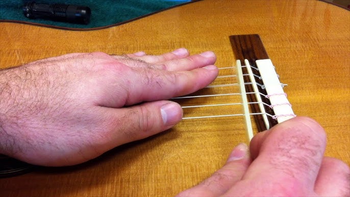 Replying to @wildd.one555 Stringing a guitar with fishing line! #guita, nylon string guitar