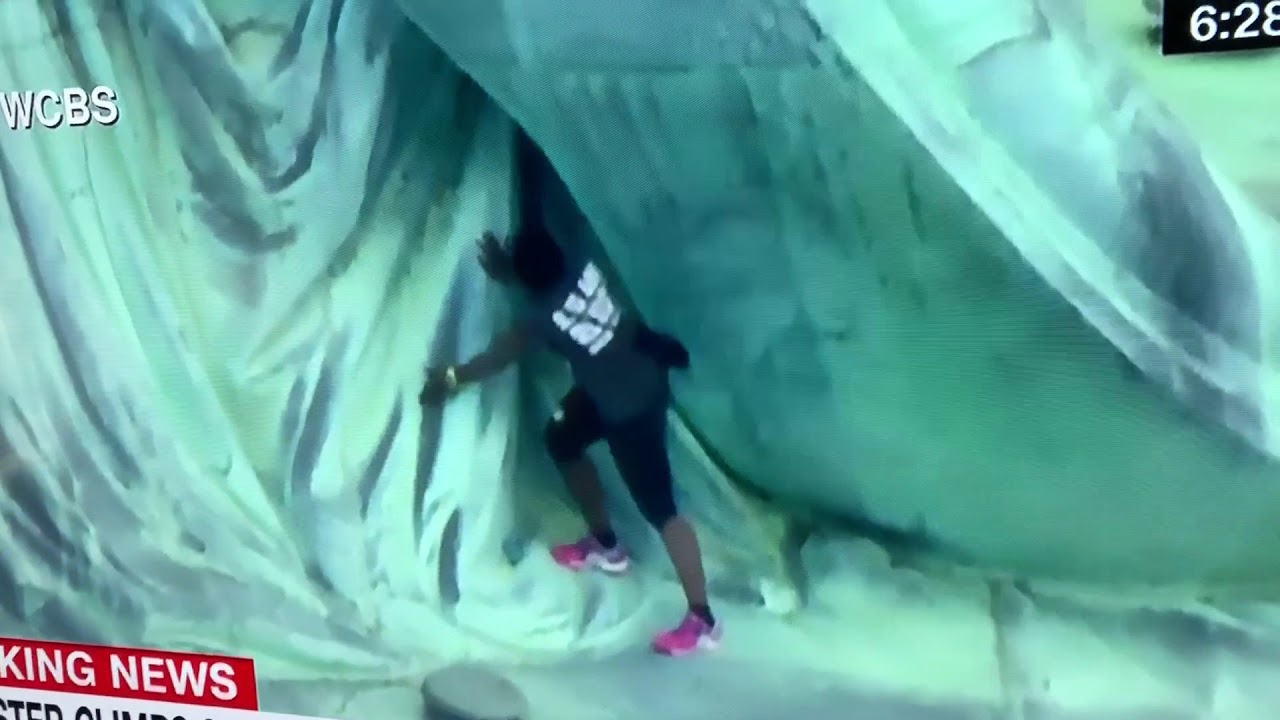 Woman climbs Statue of Liberty to protest migrant family separations ...