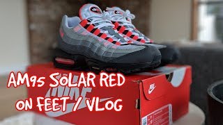 air max 95 og solar red on feet