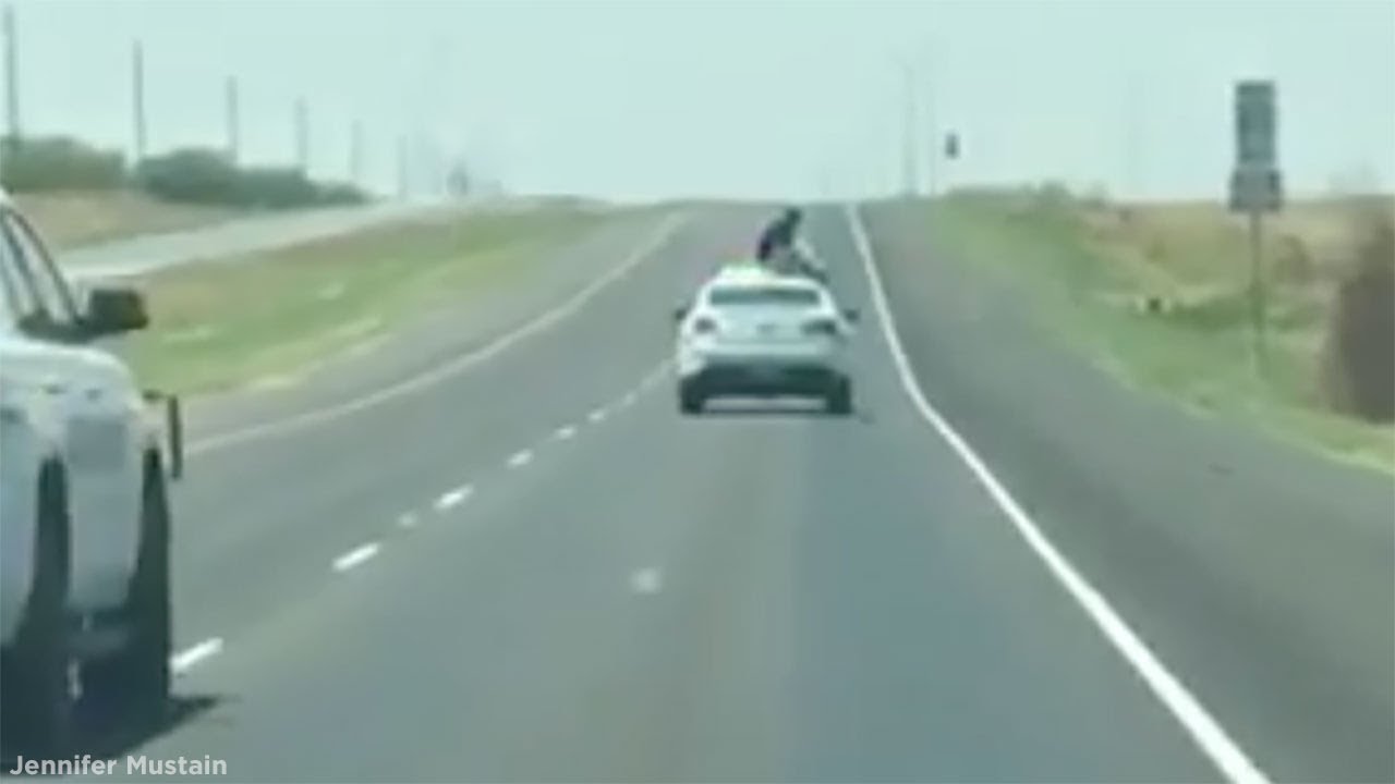 newspaper mockup Prisoner climbs on top of patrol car driving down highway