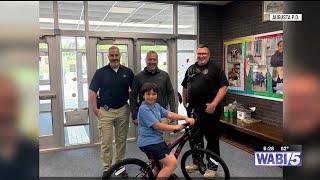 Augusta officer helps out child with new bicycle