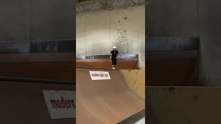 Scooter rider does flip from top of quarter pipe at skatepark and lands on his shoulder