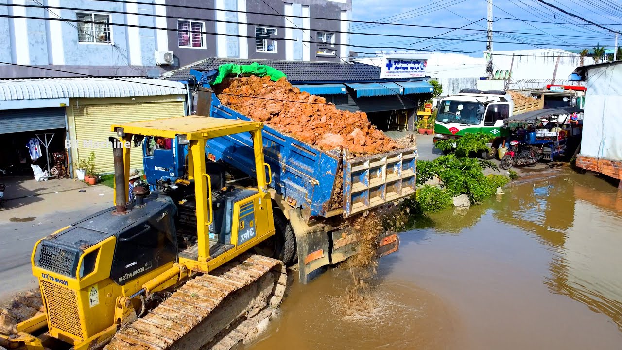 Start New project filling big pond by D31p.x bulldozer cooperate with dump truck