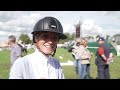 Emily King thrilled with her horse in an atmospheric dressage arena