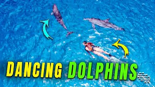 Swimmer Dancing and Trancing with Dolphins