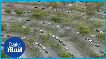 Omicron US: Drone footage shows long testing lines as COVID cases reach record high