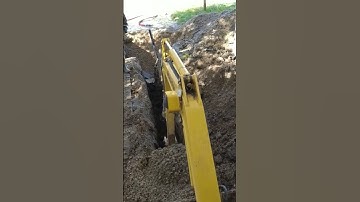 KOMATSU mini excavator operator digging trench