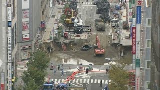 Thousands of trucks begin filling massive sinkhole in Japan