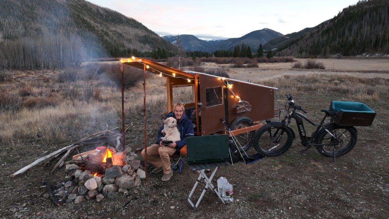 Camping and cooking on a sunny fall day in the bike cabin with my dog