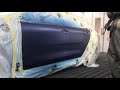 Spraying/Blending Blue Kia.