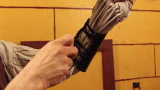 Tying Bracers With One Hand