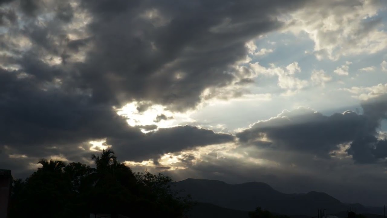 Sunlight shining through clouds timelapse