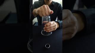 HOW!?! COIN PASSES THRU A CUP!