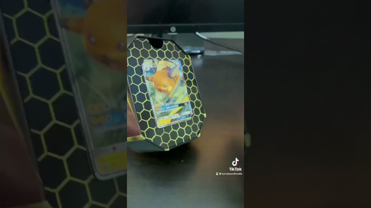 Opening a Hidden Fates Raichu GX Tin!