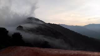 Beautiful time lapse of clouds over mountains