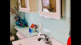 Make A Stylish Bathroom Backsplash With Easy-to-Install Peel-and-Stick Tiles
