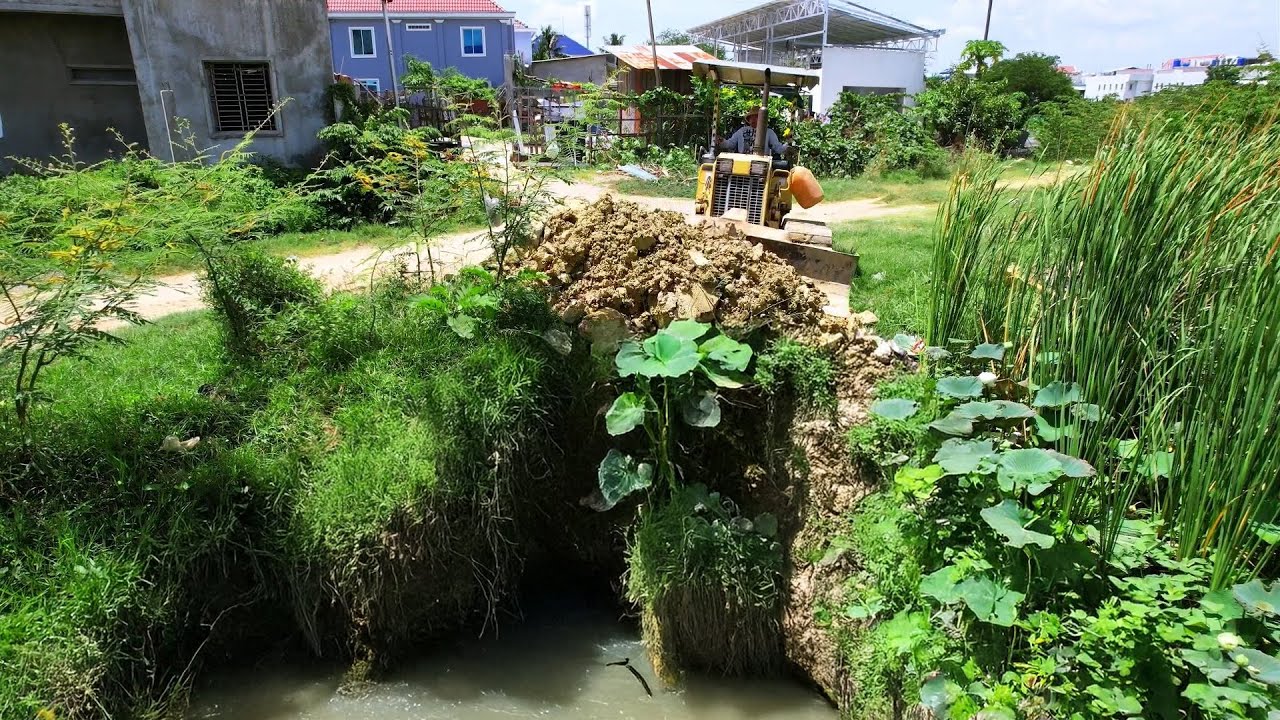 NEW Project: Dump Truck Unloading Dirt into Land lake to make Fill with Dozer Pushing.
