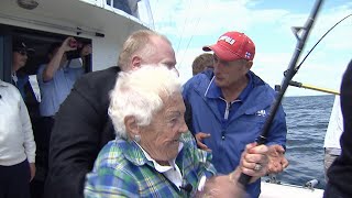 Rob Ford holds Hazel McCallion as she reels in a fish | Archive video