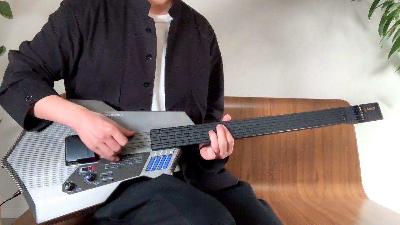 Musician Showcases His Talent on a Complex Casio Digital Guitar With  Onboard MIDI Synthesizer