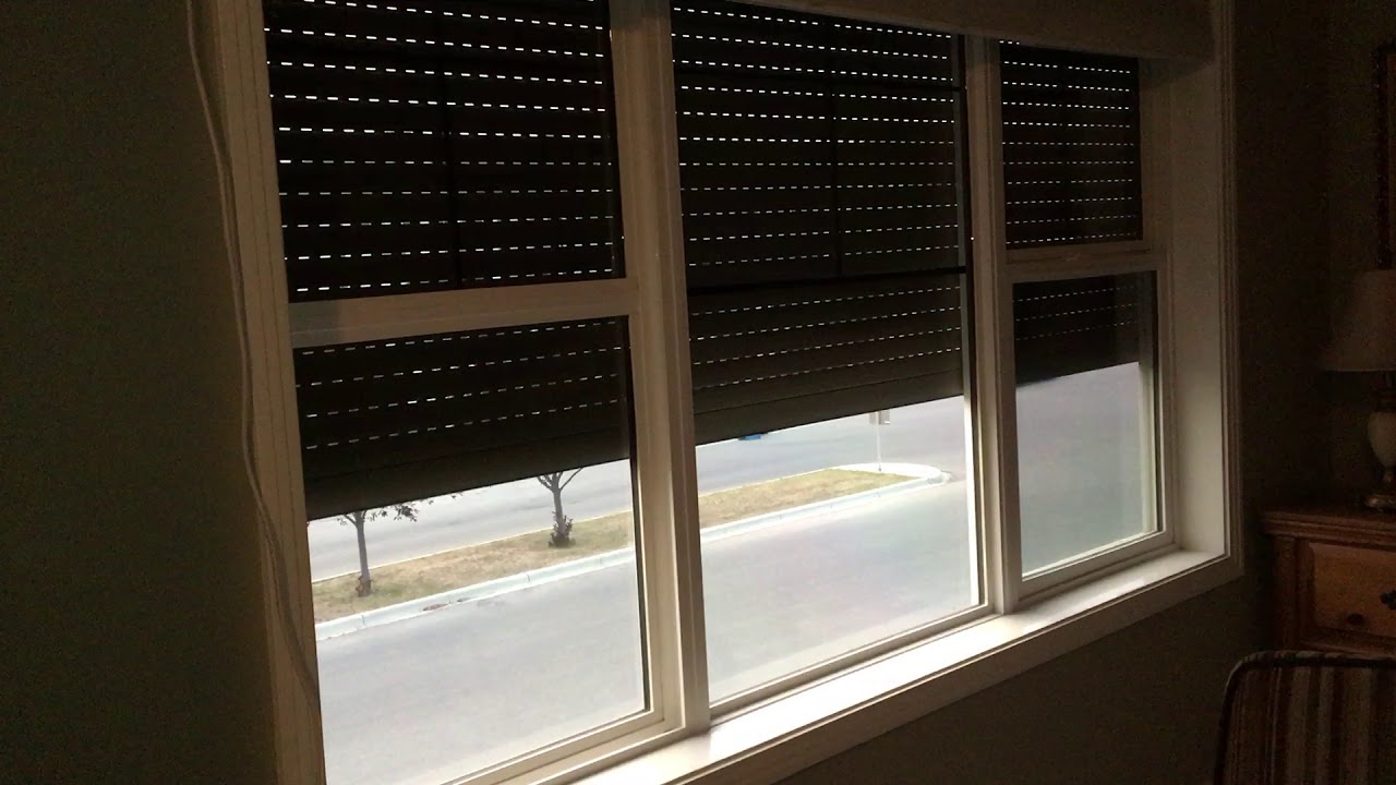 Motorized Roll Shutters Inside view going up Awnings And More Inc