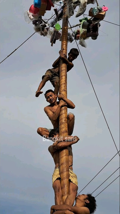 Boy almost falls while taking part in pole climbing competition #boy #competition #pole climbing ...