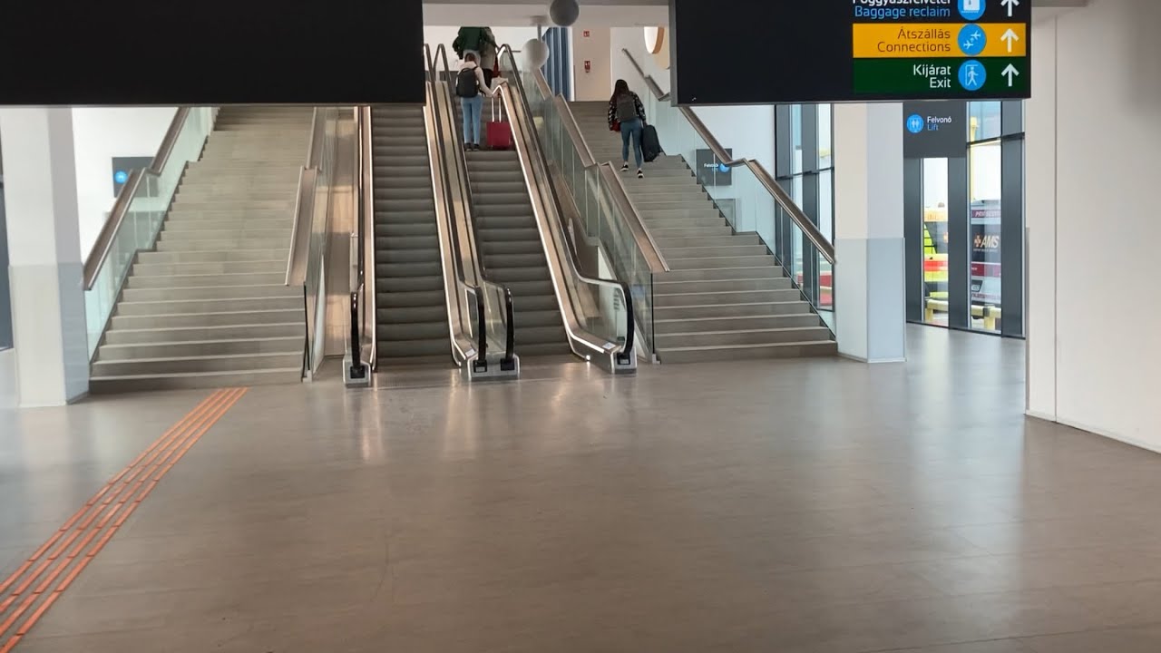 Budapest Airport - 3x KONE escalator ride from some gates toward the arrivals exit