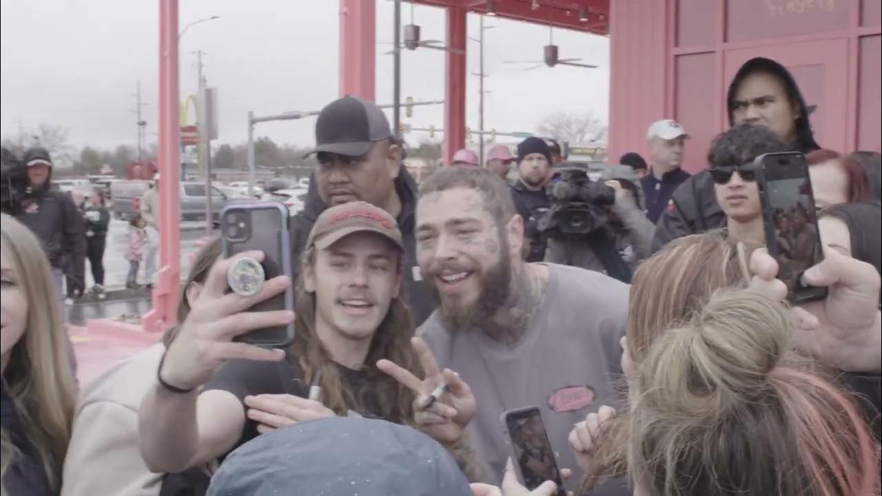 Post Malone walks through a Utah Raising Cane's restaurant he custom
