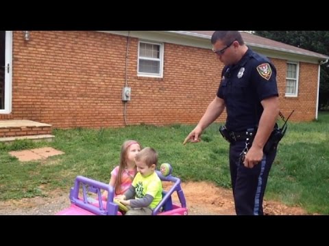 Police Officer Dad Pulls Over Kids in Power Wheels Gets Funny Reaction