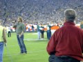 John and Tammy on Field during James Otto National Anthem