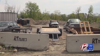 Judge orders West Warwick family business to remove road block