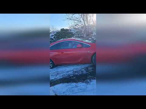 N-ice-ly done: Moment man sidesteps skidding car to narrowly avoid being wiped out on icy hill