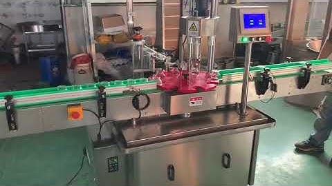 Automatic pick and place capping machine for glass bottles