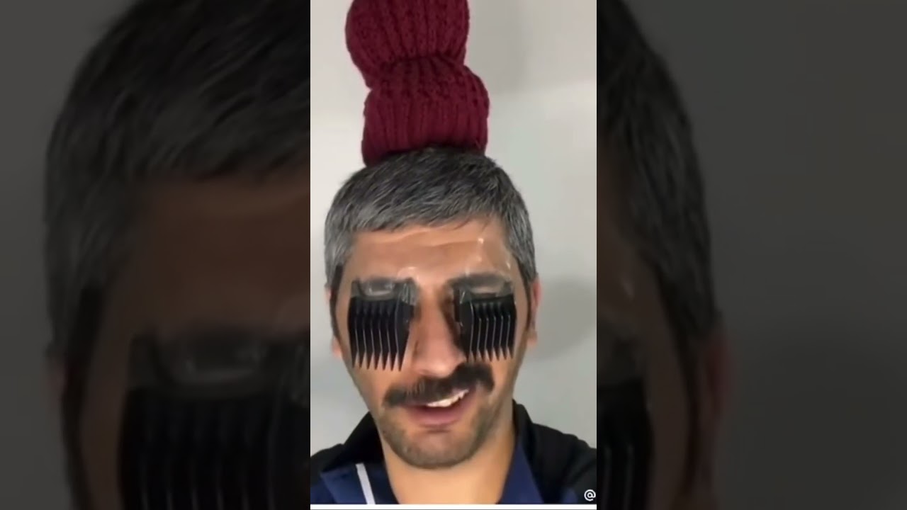 Heavy eyelashes long nails messy bun troll chain