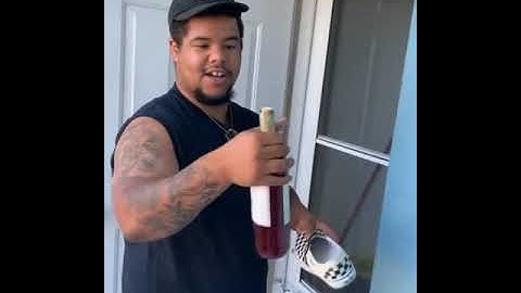 Guy shows us how to open a wine bottle without a wine opener.