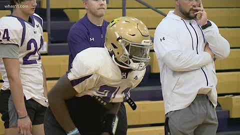 Male running back Daniel Swinney powers through tr...