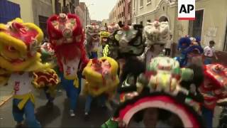 Thousands of people line the streets of Lima's Chinatown to celebrate the arrival of a Lunar New Yea