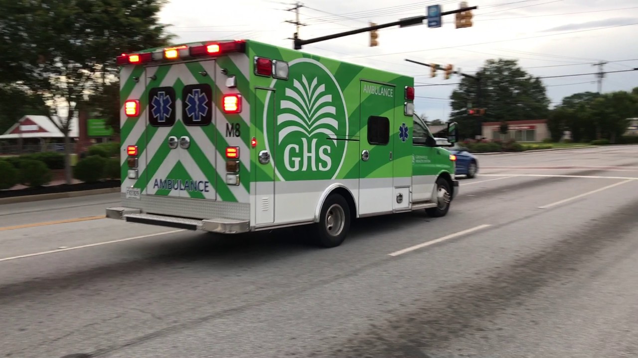 GREENVILLE HEALTH SYSTEMS EMS AMBULANCE RESPONDING ON MAIN STREET IN