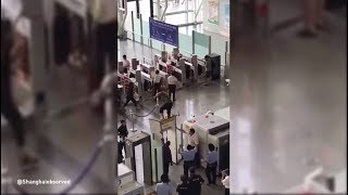 Guy Jumped Over A Scanner Machine In Shanghai's Airport And Broke It