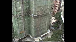 Workmen using single row bamboo scaffolding on a building Mid-Levels Hong Kong Oct 1997