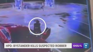 Surveillance video shows bystander who shot, killed robber at Houston gas station