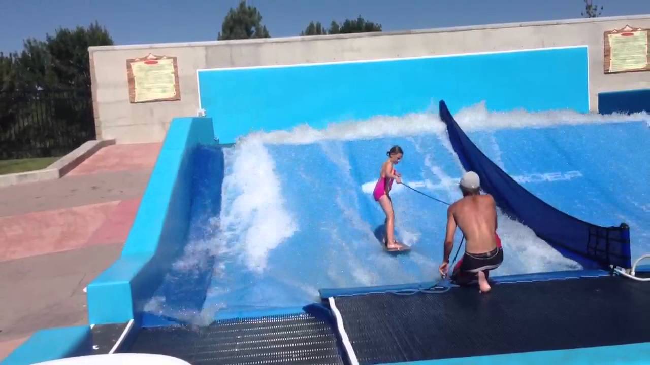 Elisa on flow rider beginner stand up - YouTube