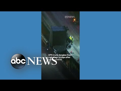 Ups truck dangles over edge of indiana bridge