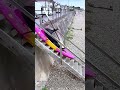 Sliding Kayak Down Coastal Stairs #worker #process #kayak #sea #outdoor